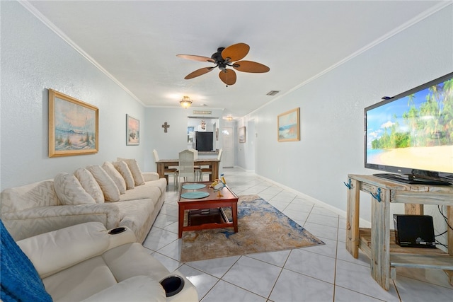 tiled living room with ornamental molding and ceiling fan