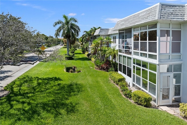 view of yard featuring a sunroom