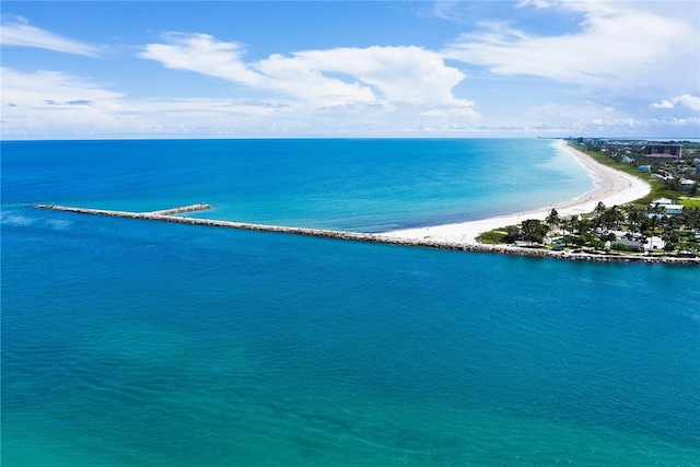 drone / aerial view featuring a view of the beach and a water view