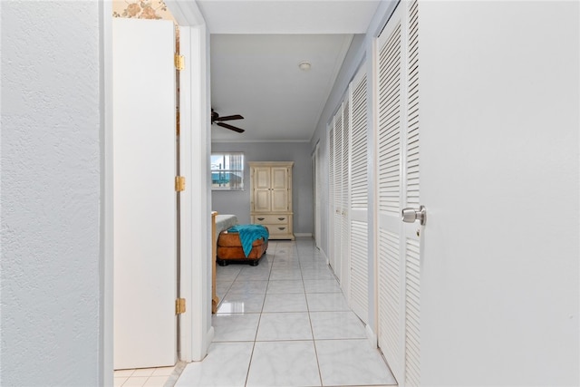 hall featuring light tile patterned floors