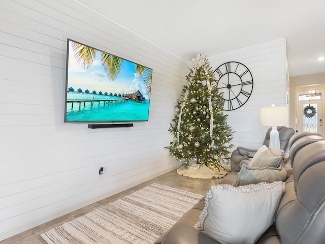 living room featuring wood walls