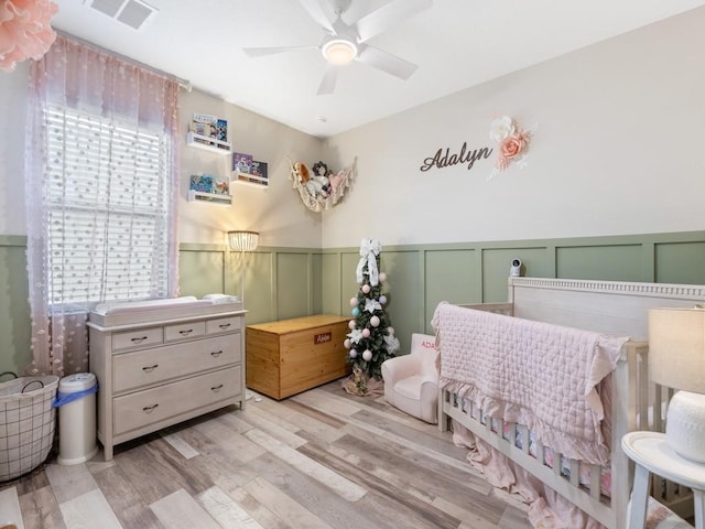 bedroom featuring ceiling fan and light hardwood / wood-style floors