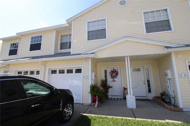 multi unit property featuring a garage