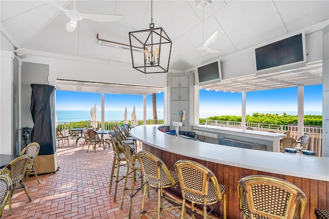 kitchen featuring ceiling fan and decorative light fixtures