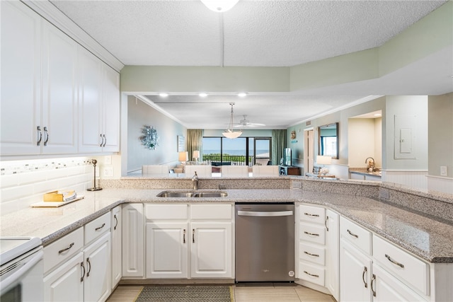 kitchen featuring dishwasher, a textured ceiling, white cabinetry, and sink