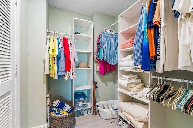 walk in closet featuring light wood-type flooring