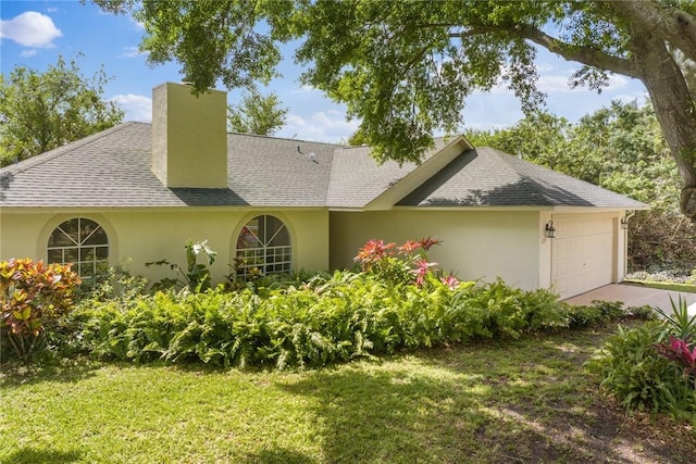 725 Wentworth St, Sebastian, FL 32958 - view of front of house with a chimney, roof with shingles, an attached garage, and stucco siding
