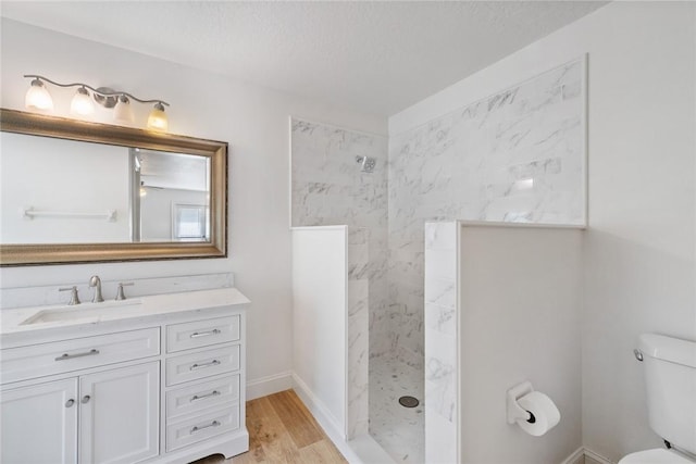 725 Wentworth St, Sebastian, FL 32958 - full bathroom with a walk in shower, vanity, toilet, wood finished floors, and baseboards