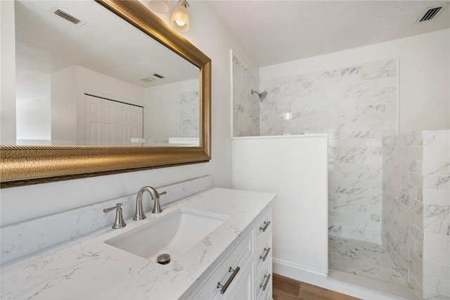 725 Wentworth St, Sebastian, FL 32958 - bathroom with a walk in shower, vanity, and wood finished floors