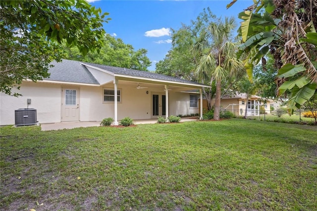 725 Wentworth St, Sebastian, FL 32958 - rear view of property with french doors, stucco siding, a ceiling fan, central AC unit, and a shingled roof