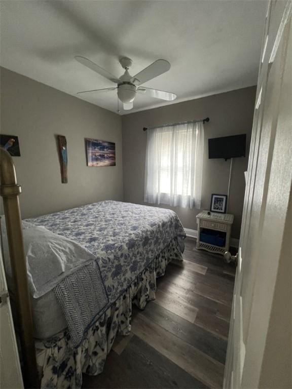 bedroom featuring dark wood-style flooring and a ceiling fan