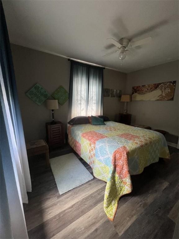 bedroom with wood finished floors and ceiling fan