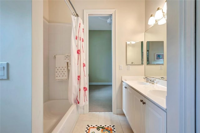 bathroom with tile patterned flooring, vanity, and shower / bath combo