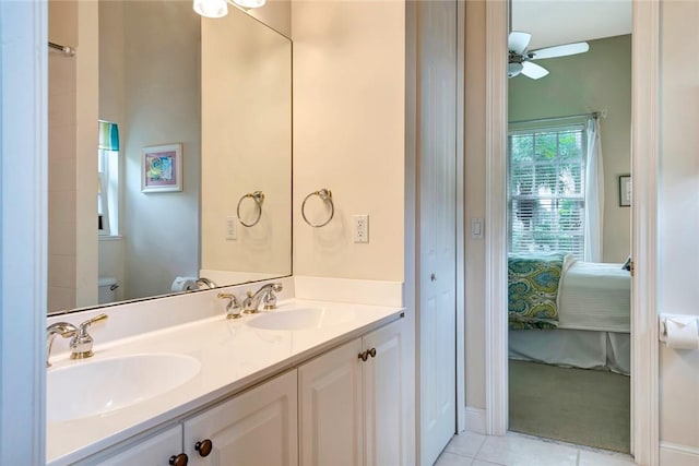 bathroom featuring ceiling fan, tile patterned flooring, vanity, and toilet