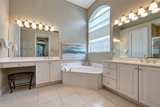 bathroom featuring tile patterned flooring, vanity, and separate shower and tub