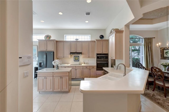 kitchen featuring kitchen peninsula, light brown cabinets, sink, and fridge with ice dispenser