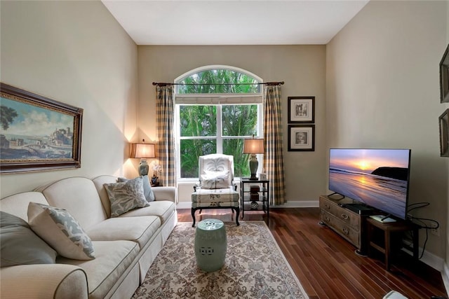 living room featuring dark hardwood / wood-style floors and plenty of natural light