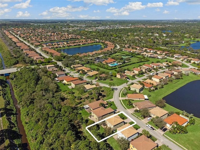 bird's eye view with a water view and a residential view