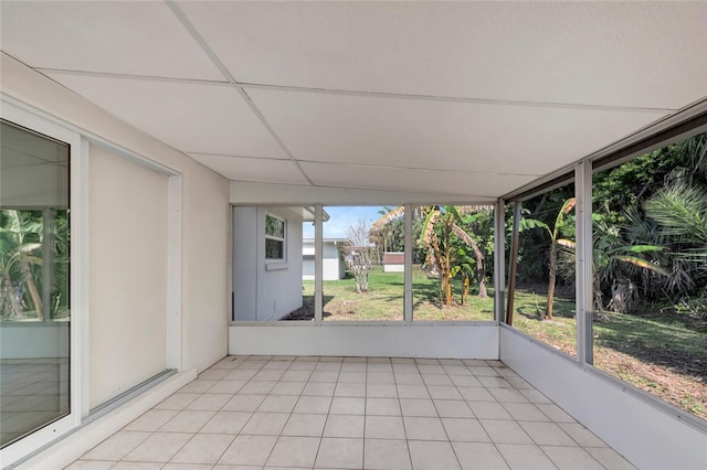 unfurnished sunroom with a paneled ceiling