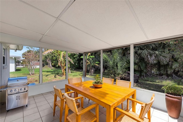 sunroom featuring a drop ceiling