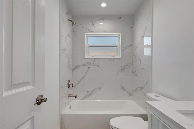 full bathroom featuring bathtub / shower combination, vanity, and toilet