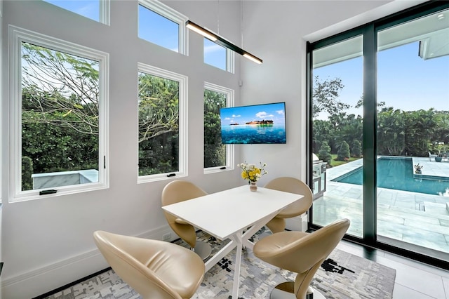 sunroom / solarium featuring plenty of natural light