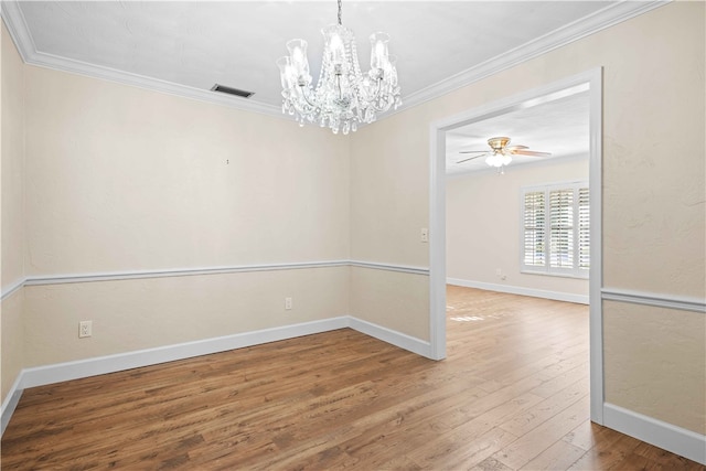 unfurnished dining area featuring hardwood / wood-style floors, baseboards, visible vents, and ornamental molding