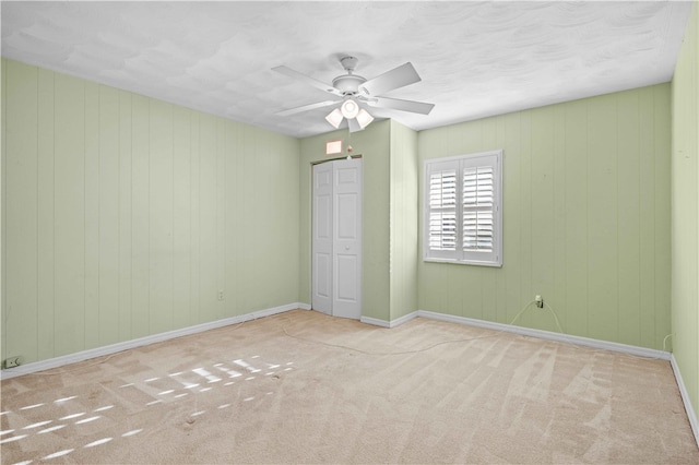 unfurnished bedroom with a closet, baseboards, and carpet floors