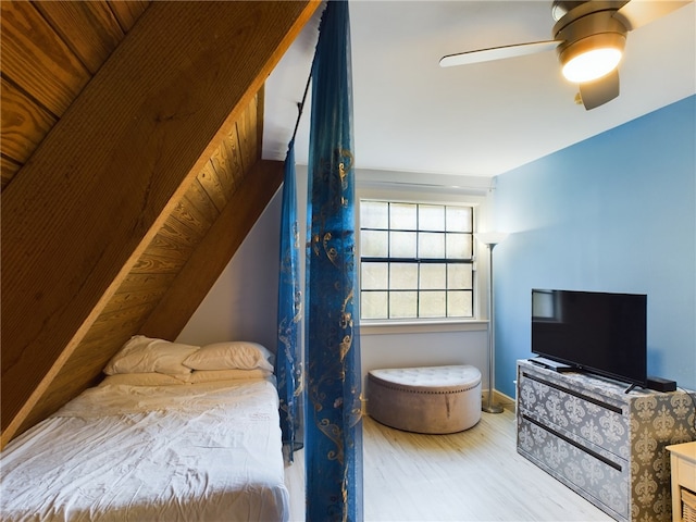 bedroom featuring wood-type flooring and ceiling fan