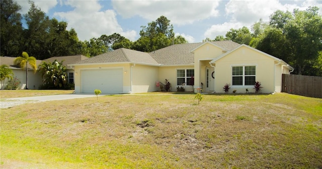 ranch-style home featuring a garage and a front yard