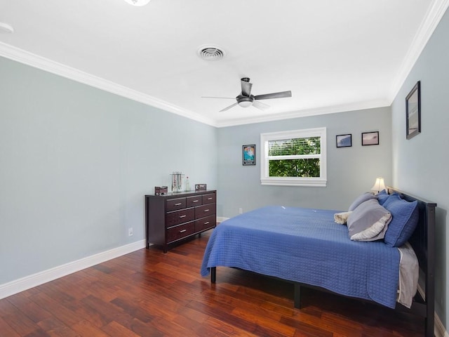 bedroom with dark hardwood / wood-style flooring, ornamental molding, and ceiling fan