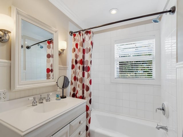 bathroom featuring shower / bath combination with curtain, vanity, and crown molding