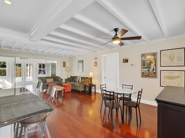 dining space with beamed ceiling, ceiling fan, dark hardwood / wood-style floors, and french doors