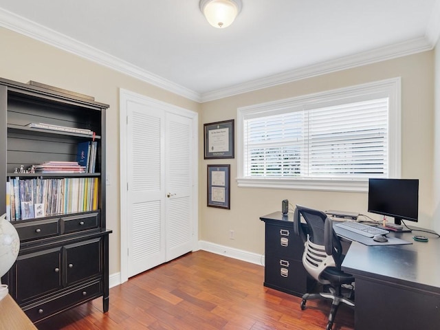 office featuring hardwood / wood-style flooring and crown molding