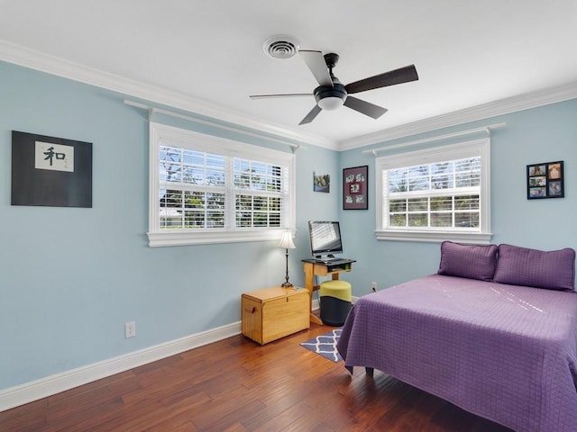 bedroom featuring crown molding, ceiling fan, multiple windows, and hardwood / wood-style flooring