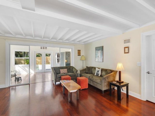 living room with beam ceiling, dark wood-type flooring, and french doors