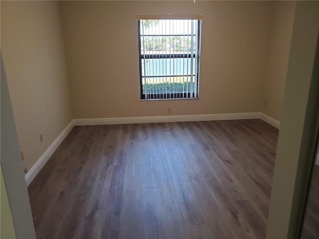 30 Plantation Dr Unit 104, Vero Beach, FL 32966 - unfurnished room with wood finished floors and baseboards