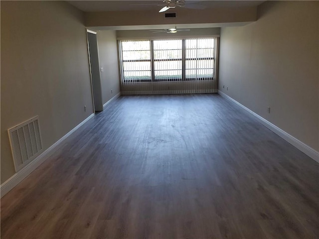 30 Plantation Dr Unit 104, Vero Beach, FL 32966 - spare room with a ceiling fan, wood finished floors, and baseboards