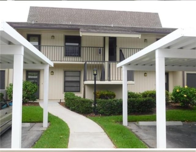 30 Plantation Dr Unit 104, Vero Beach, FL 32966 - view of property with parking