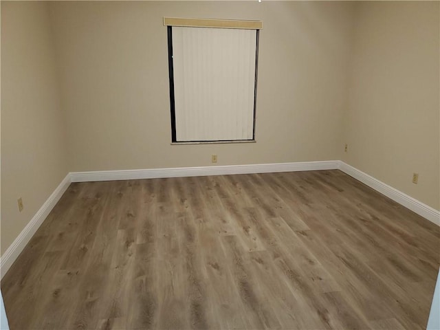 30 Plantation Dr Unit 104, Vero Beach, FL 32966 - unfurnished room with baseboards and wood finished floors