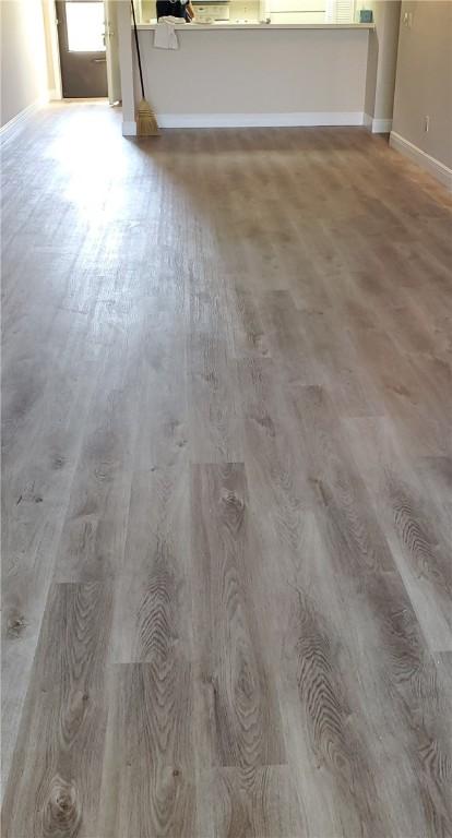 30 Plantation Dr Unit 104, Vero Beach, FL 32966 - detailed view of wood finished floors and baseboards