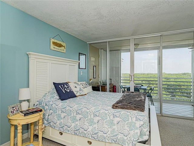 935 E Causeway Blvd Unit 505, Vero Beach, FL 32963 - carpeted bedroom with access to outside and a textured ceiling