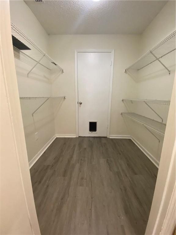 473 Englar Dr, Sebastian, FL 32958 - walk in closet featuring wood finished floors