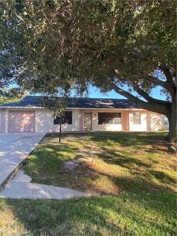 473 Englar Dr, Sebastian, FL 32958 - single story home with a front lawn, a garage, and driveway