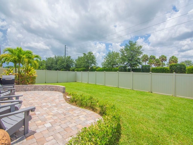 2641 Crowned Eagle Cir SW, Vero Beach, FL 32962 - fenced backyard with a patio area