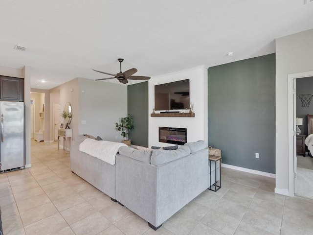 2641 Crowned Eagle Cir SW, Vero Beach, FL 32962 - living room with ceiling fan, light tile patterned floors, a glass covered fireplace, and recessed lighting