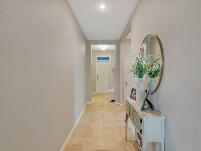 2641 Crowned Eagle Cir SW, Vero Beach, FL 32962 - hall featuring light tile patterned floors and baseboards