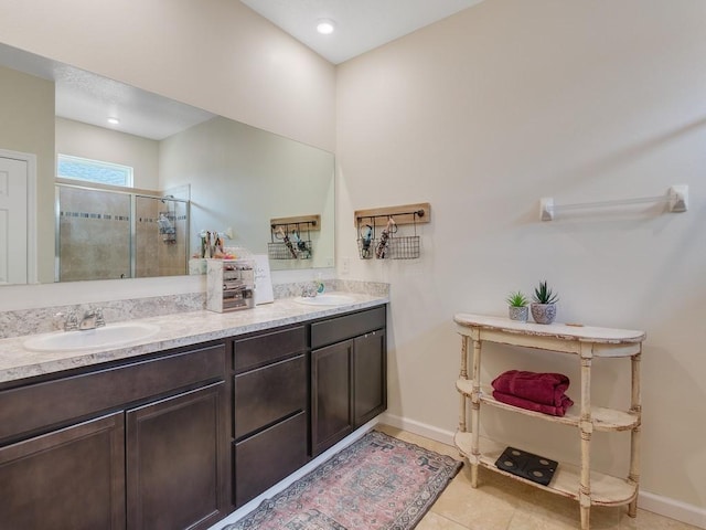 2641 Crowned Eagle Cir SW, Vero Beach, FL 32962 - full bathroom with a shower stall, double vanity, and tile patterned floors