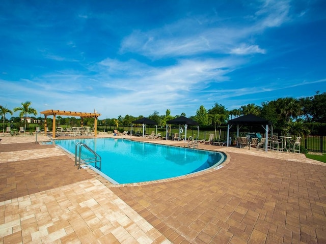 2641 Crowned Eagle Cir SW, Vero Beach, FL 32962 - community pool featuring a gazebo, a pergola, and a patio