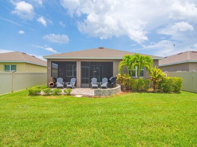 2641 Crowned Eagle Cir SW, Vero Beach, FL 32962 - back of property with a patio, a fenced backyard, a sunroom, and stucco siding